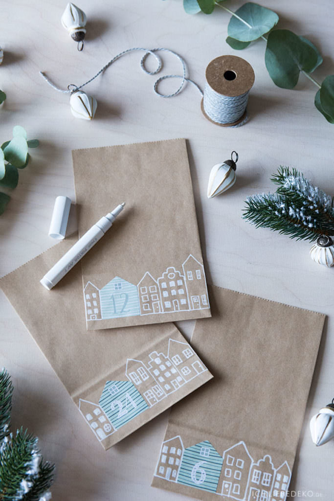 diy-adventskalender-aus-kraftpapiertueten-mit-gezeichneten-haeusern